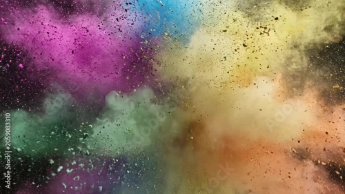 Vibrant multicolored powder explosion isolated on a dark background