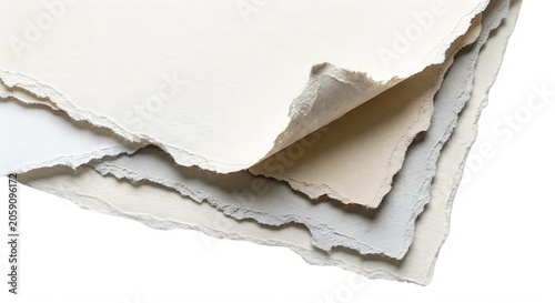 Stack of several sheets of torn paper with rough edges and textured surface layers for artistic craft projects and creative design backgrounds or stationery templates used for scrapbooking or letters