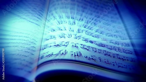 Holy Quran Book Opening with Glowing Blue Light Rays, Islamic Religion and Faith Concept