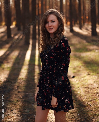 Autumn romantic walk, girls in the forest at sunset
