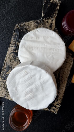 Brie or Camembert cheese is a white, round shape for baking and melting. Camembert cheese as a food background for your design