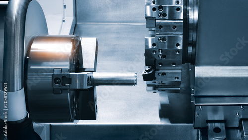 Tableau sur toile Metal rod spins precisely between lathe chuck jaws