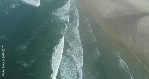 Aerial view of rhythmic waves on a sandy beach The Concept of coastal rhythm