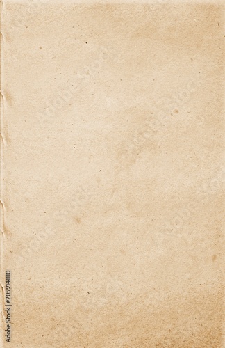 Detailed paper texture of a beige interior book page with visible natural fibers and tiny organic specks. High-quality grunge background for editorial design, book mockups, and vintage stationery them