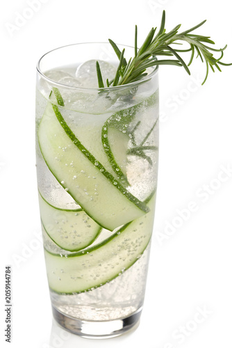 Refreshing cucumber and rosemary cocktail with ice in a tall glass.