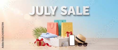 July sale promotional banner with colorful shopping bags summer fashion accessories and empty smartphone screen display on a minimalist studio background for retail marketing campaigns