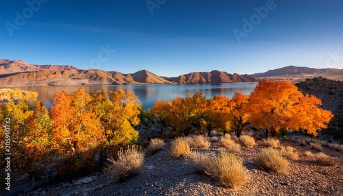 Pahranagat Lake Nevada At Golden Hour With Desert Mountains And Autumn Trees