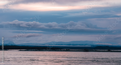 Alaskan Sunset Over Snow-Capped Mountains