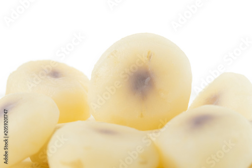 boiled and peeled water chestnuts arranged on a white background, Close-up