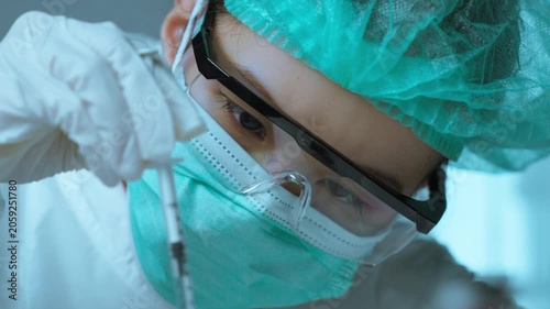 Medical Researcher Drawing Pharmaceutical Sample into Syringe for Laboratory Analysis
