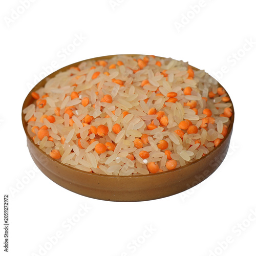 Uncooked Rice and Lentils mixed in a rustic bowl with soft studio lighting for culinary concepts