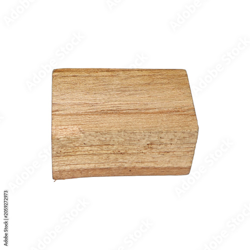 Unfinished wooden block with grain texture against a bright studio light for rustic design elements