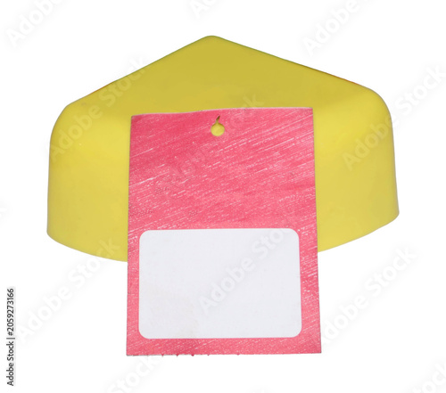 Yellow corner protector with blank red tag during studio shoot