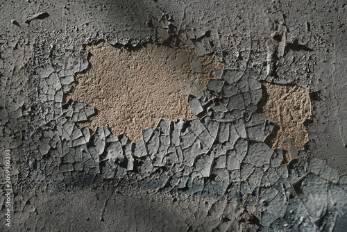 Photos Peeling paint on an old wall showing cracked and damaged surface