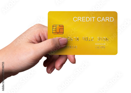 A close-up man hand holds a gold credit card isolated on white background with a clipping path.