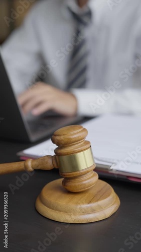 Lawyer typing on laptop doing Legal documents