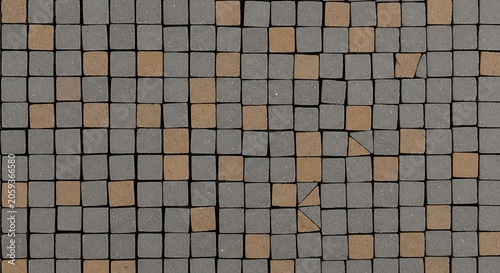 Abstract geometric mosaic pattern of beige and gray squares on dark background
