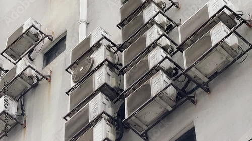 Multiple Air Conditioning Units Mounted on Urban Building Wall