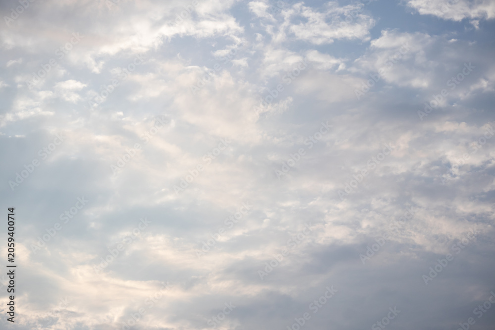 Fototapeta premium Beautiful blue sky background with scattered white clouds on a sunny day