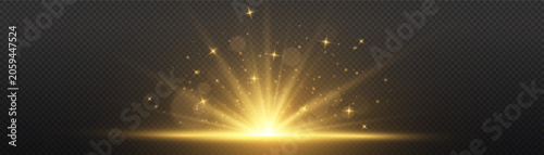 Fotografie Golden light rays rising from bottom of dark frame representing sunrise or sunse