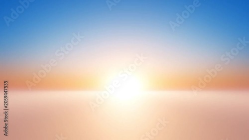 Bright sun rising over a calm horizon with soft pastel colors in the sky at dawn