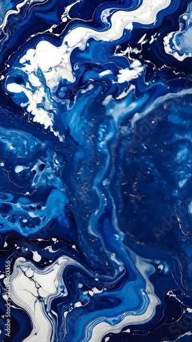 Abstract fluid art with swirling blue and white paint patterns