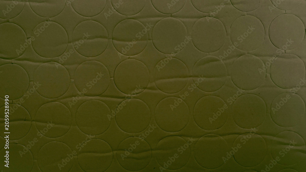 Naklejka premium olive green quilted fabric texture with geometric circle pattern background