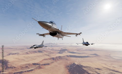 Vászonkép Fighter Jets Flying Over Desert Landscape in Military Formation With Clear Sky —