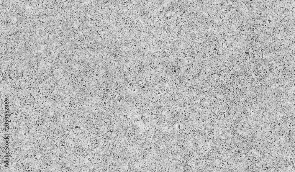 Fototapeta premium A speckled concrete ground with tiny pebbles and granular texture. Seamless black and white background photo