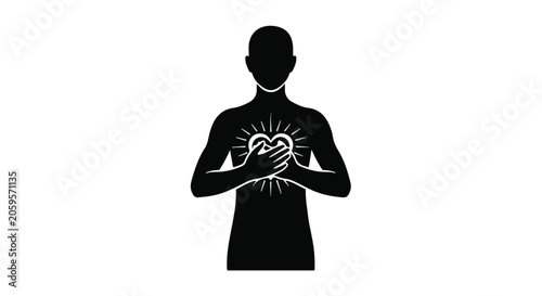 Silhouette of a person holding a glowing heart with radiant light, symbolizing love and compassion.
