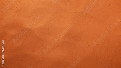 Texture of a dry clay wall found in an outdoor setting during daytime under natural sunlight