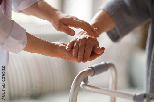 Caregiver Comforting Elderly Patient with Compassionate Touch