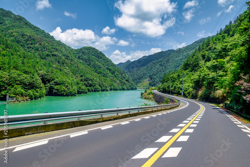 Photography Summer river road in a green valley