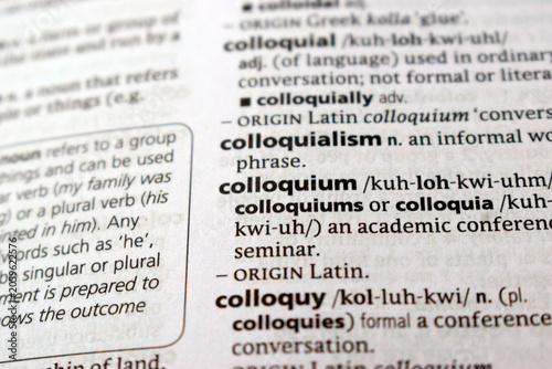 Obraz na plátně Close Up Of English Explanation Dictionary Page Word Of -  colloquium