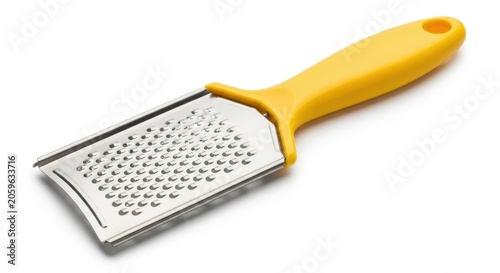 Kitchen grater with a yellow handle isolated on white background