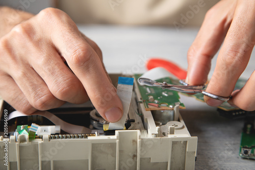 Engineer repair circuit board of electronic device.