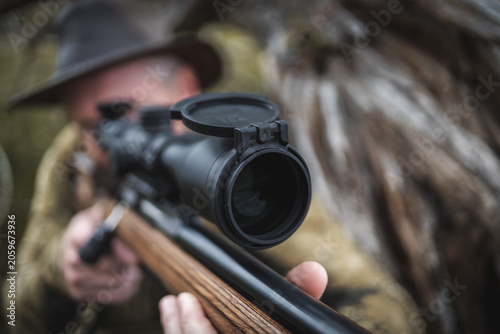 Tableau sur toile Rifle scope with protective lens cap in focus
