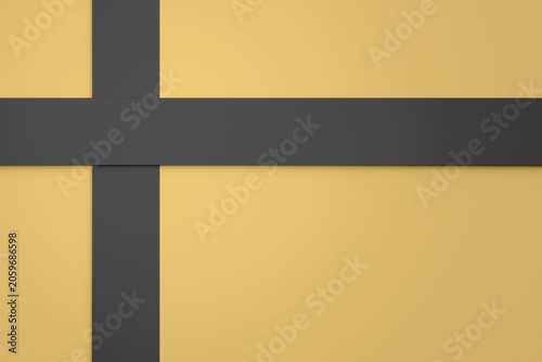 Minimalist closeup background of a gift package wrapped with black ribbon on yellow surface