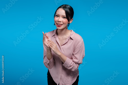 Smiling Indonesian Woman Clapping Hands