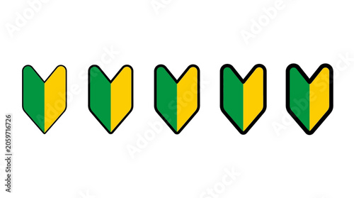 japanese shoshinsha mark a beginner driver symbol in green and yellow representing new driver safety and road rules.