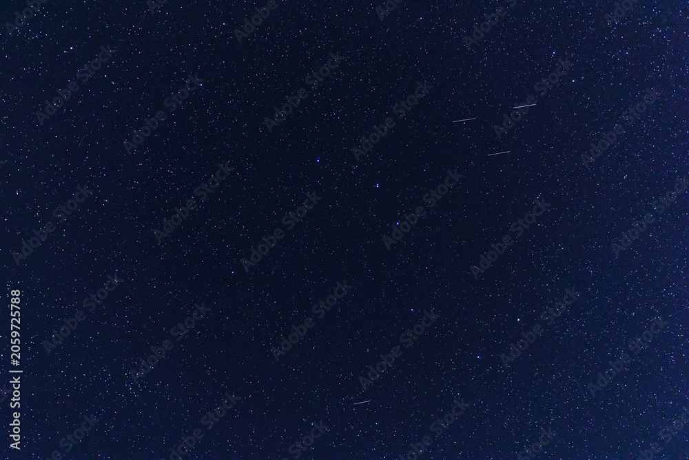 Fototapeta premium Constellations and Milky Way stars on a dark countryside skies.