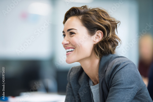 Mature business woman entrepreneur in boardroom, poised CEO, resilient leader, diverse colleagues, investor briefing, teamwork success