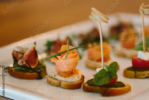 Obraz na płótnie Gourmet canap?s with smoked salmon and garnish