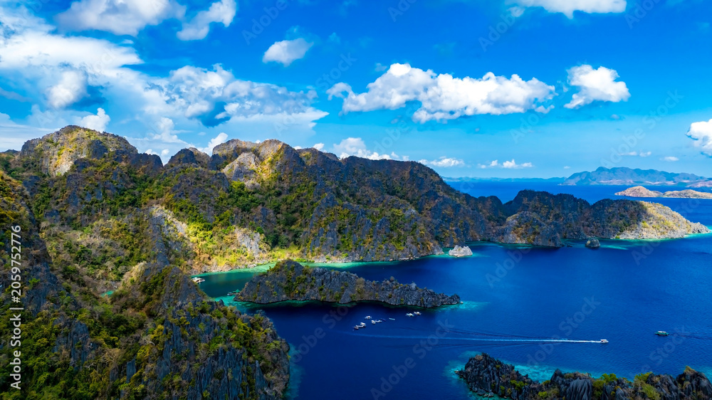 Obraz premium Aerial view of a beautiful tropical island with crystal clear water with limestone cliffs as the beach, Coron, Palawan, Philippines.