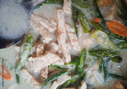 green chili peppers and tempeh cooked in coconut milk