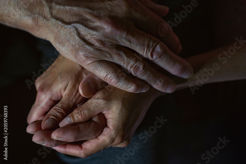 Holding hand to provide care and comfort during sickness