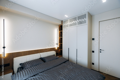Photos Modern bedroom interior with built-in wardrobe and soft lighting