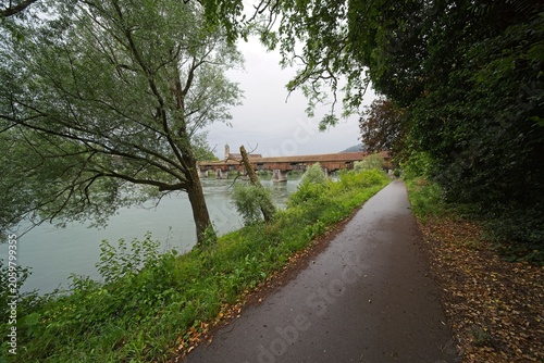 Bild auf Leinwand The wooden bridge over the Rhine connects Germany and Switzerland
