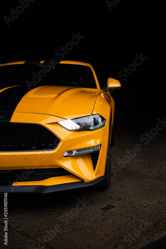 Yellow Sports Car Headlight and Front Bumper