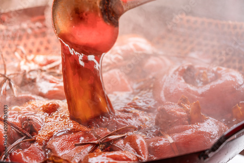 Картината върху платно braised pork trotters simmered in traditional brine pot drizzled with savory sau